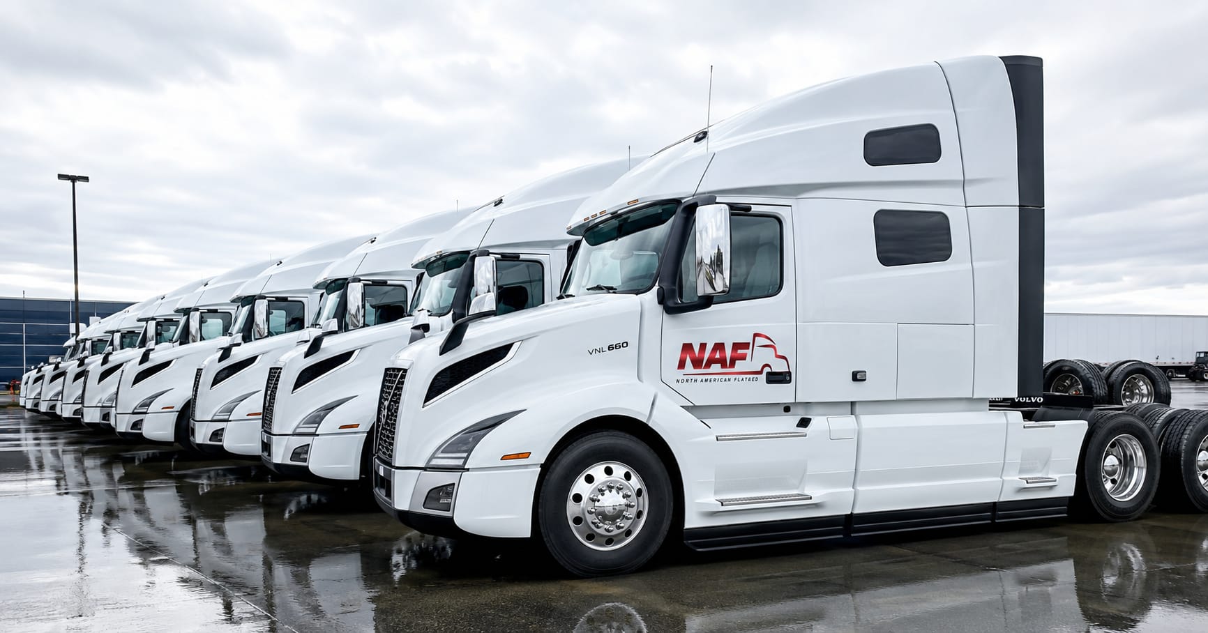 North American Flatbed fleet of white trucks lined up